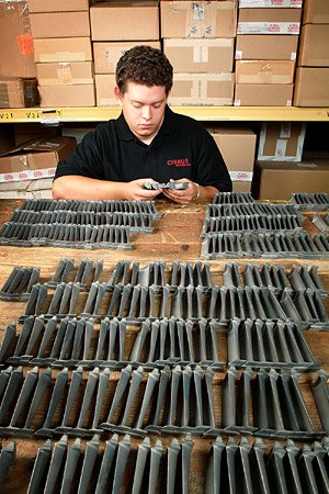 Dave Avila inspects blades in the Cirrus warehouse